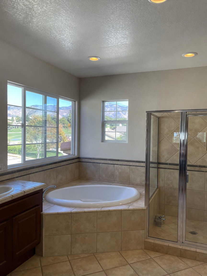 Finished bathroom with freshly painted walls and ceiling